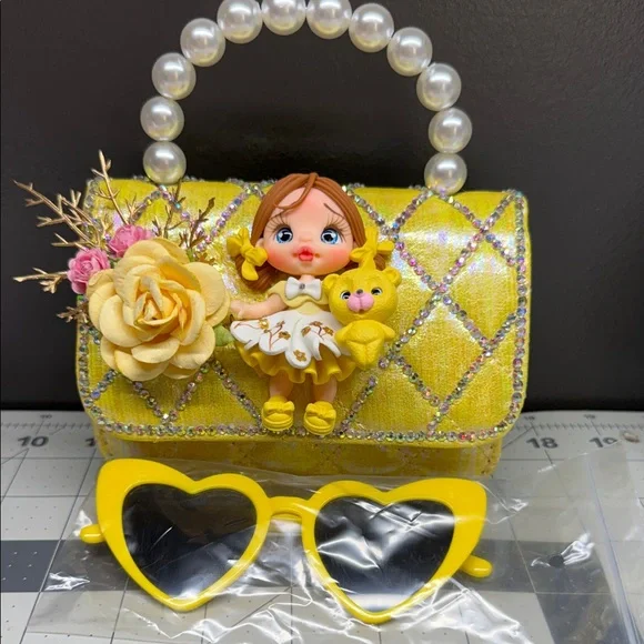 Yellow Pearl-Handle Kids Handbag with Doll and Flower Accent - Picture 2 of 4
